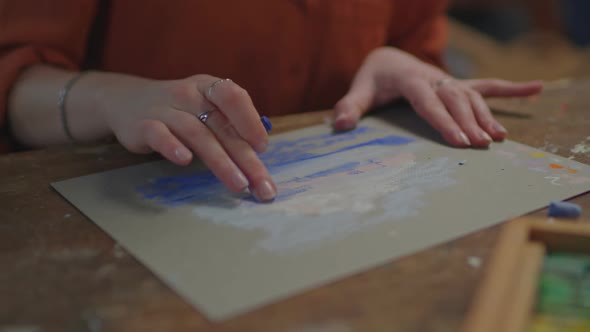 Artist Hand Creating Picture with Pastel Crayon