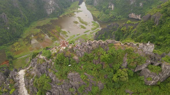 Aerial Shot of the Small Temple and a Dragon on the Top of Marble Mountain Mua Cave Mountain in Ninh