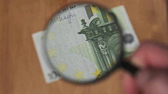 One Hundred Euro Under Magnifying Glass