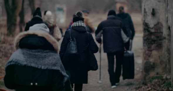 Refugees Migrating Through Ruins In Cold During War Crisis