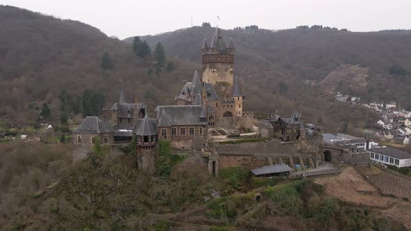 beautiful close up circular drone footage of the castle in cochem city next to the river moselle in