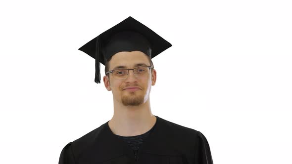 Happy Man in Graduation Gown Taking Off Medical Mask Virus in Over on White Background