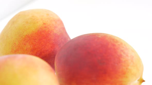 Peaches fresh juicy fruit UHD 4k 2160p footage panning on white background - Peaches on white backgr