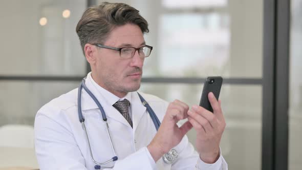 Portrait of Doctor using Smartphone