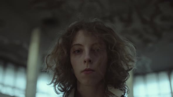 Portrait of Woman in Abandoned Building