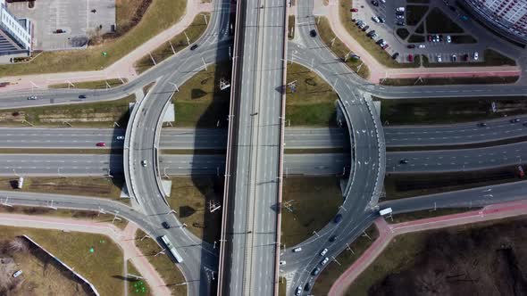 Aerial overhead top down view timelapse of car traffic on roundabout on a sunny day.