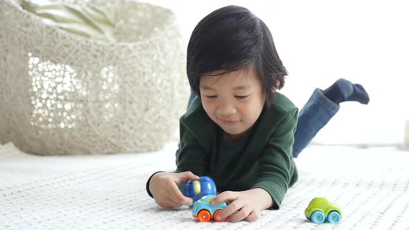 Cute Asian Child Playing Toy Cars Slow Motion 