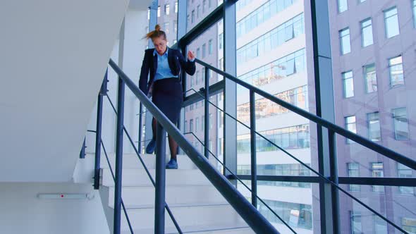 Girl Goes Down Stairs in Good Mood Dancing