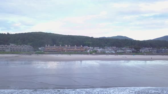 Aerial low altitude flying over water at Cannon Beach Oregon