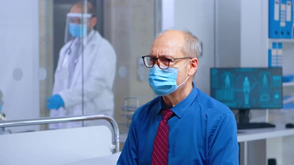 Worried Senior Patient with a Mask