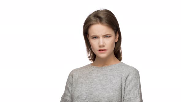 Portrait of Woman with Confident Facial Expression Looking on Camera Strictly and Holding Index