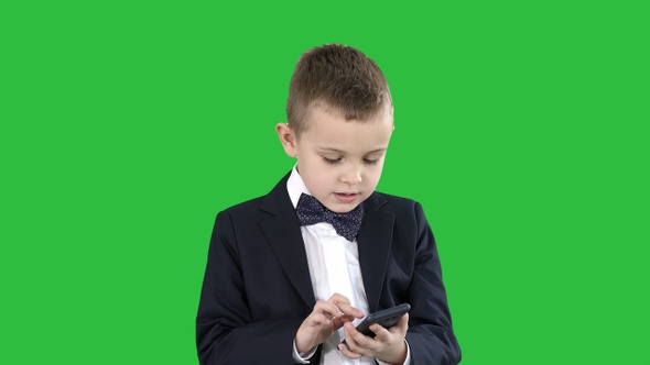 Intelligent boy is texting message playing online games,