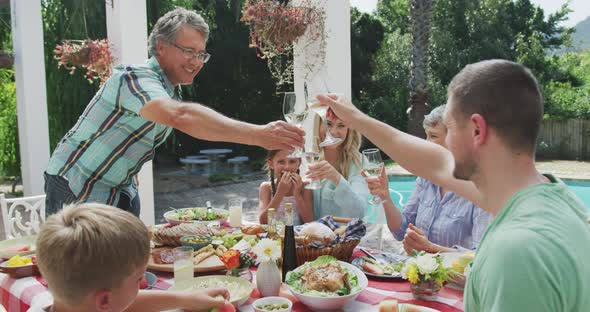 Happy family eating together at table