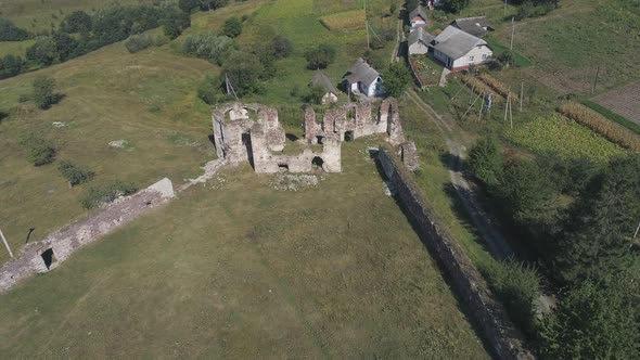 Aerial of ruins near houses