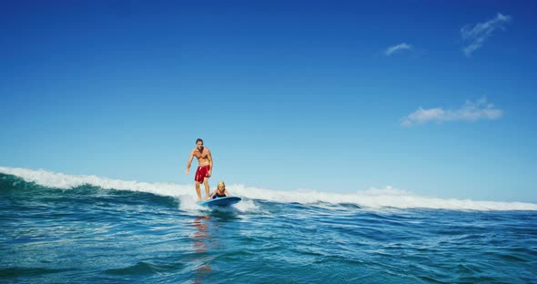 Father and Sun Surfing