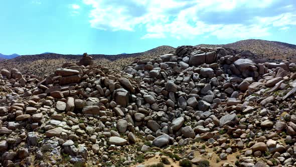 Spinning drone shot of the large rocks at Boulder Gardens in Pioneertown, California.