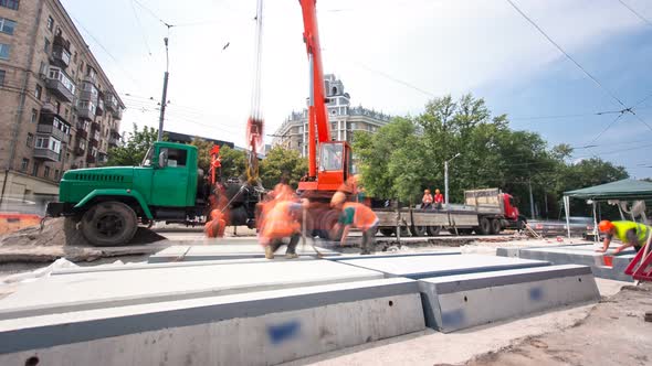 Installing Concrete Plates By Crane at Road Construction Site Timelapse Hyperlapse.