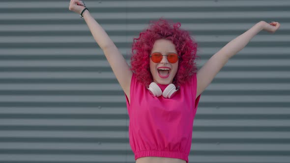 A Pink Curly Girl is Having Fun or Relaxing and Enjoying Summer