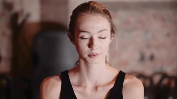 Extremely Tired Woman at Gym Resting