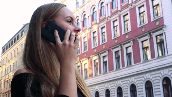 Young Beautiful Woman Phone in the City - Building in the Background