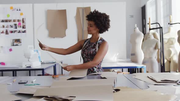 Mixed race woman working in creative office