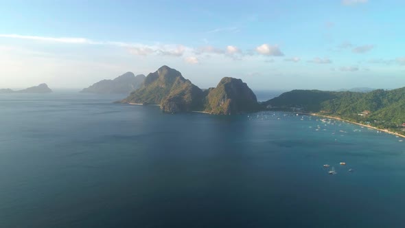 Aerial View of Beach Sea and Mountain in the Sunset