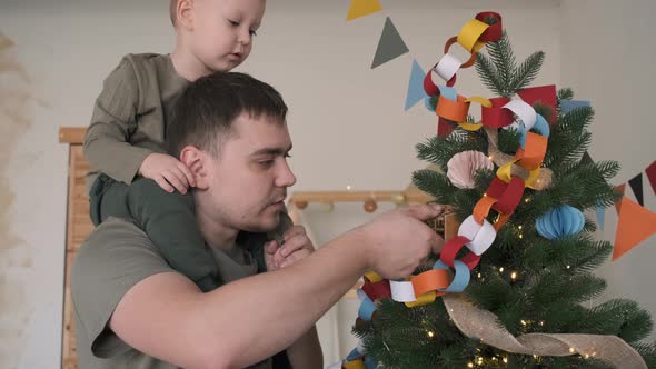 Little Boy with Dad Decorating Christmas Tree