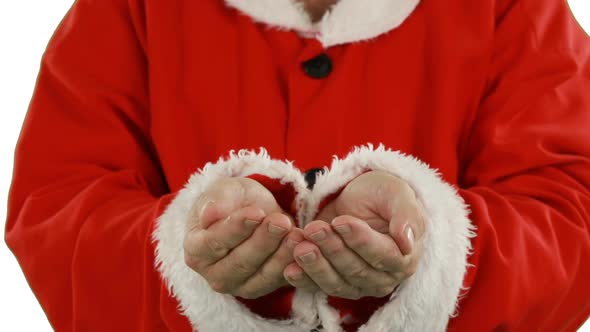 Mid-section of santa claus with hands cupped