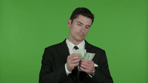 Greedy Businessman Counting Money and Asking for More, Chroma Key