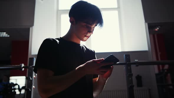 Portrait of an Athlete Talking on a Cell Phone