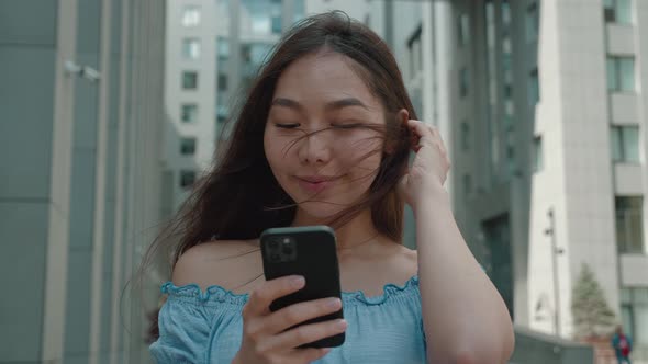 Close Up Young Asian Woman with Spartphone in Outdoor