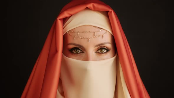Close Up Portrait Of Beauty Young Muslim Woman In Hijab Looking At Camera.