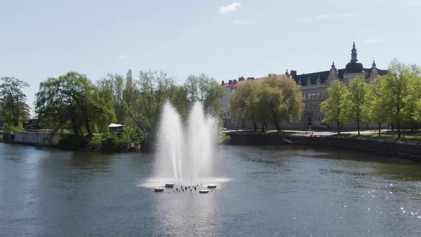 Orbital shot of fountain in Motala ström canal river system at Norrköping Sweden