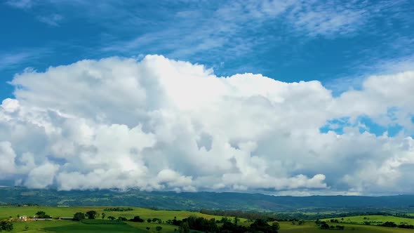 Countryside rural clouds Timelapse. Tropical scenery. Motion at blue sky.