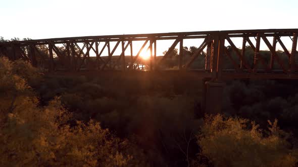 Sunlight shining through railway bridge