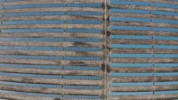 Top Aerial View of a Solar Farm. Rows of modern Photovoltaic Solar Panels. Energy Farm