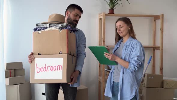 Couple in Love in a New Empty Apartment are Standing