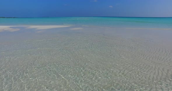 Natural overhead island view of a sandy white paradise beach and turquoise sea background in colourf