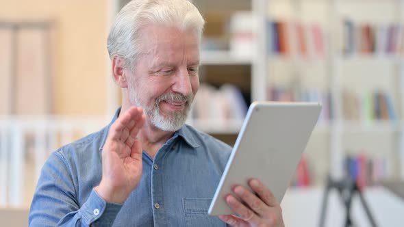 Cheerful Old Man Doing Video Chat on Tablet 