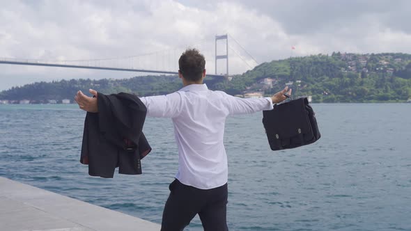 Businessman relaxing by the sea.