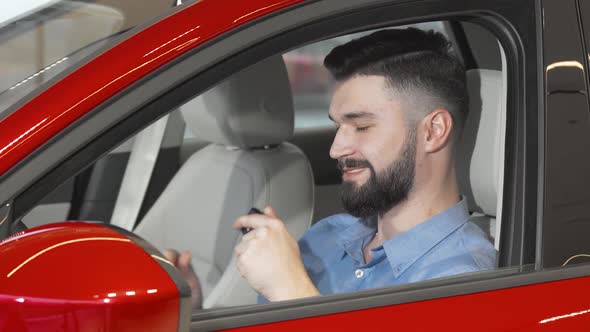 Handsome Happy Man Showing Keys to His New Car