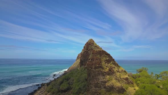 Aerial view of Mountain revealing beautiful Pacific ocean on Oahu