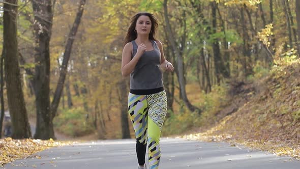 Fitness woman working out outdoors. The concept of morning running.