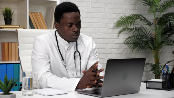African American Man Online Doctor Talking to Patient Video Call Webcam Laptop