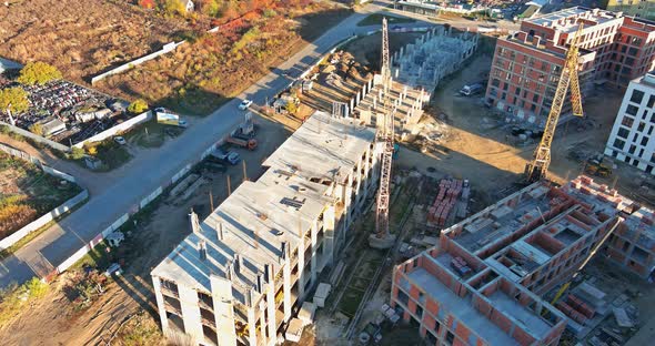 Top View Several Construction Tower Cranes of Different Heights at a Building Site During the