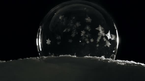 Ice Globe Freezing in Cold Winter Morning on Black Background