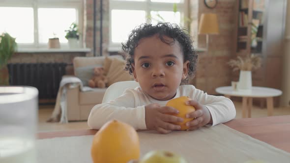 Portrait of Toddler with Fruit