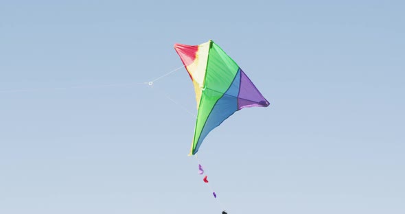 Video of multicoloured kite flying high on wind