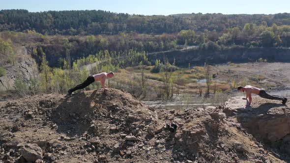 Shirtless sportsmen training on the nature background