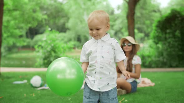 Smiling Toddler Standing in Park. Children Playing Together Outdoors